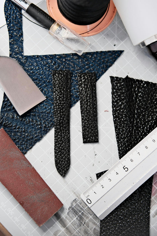 a close up of a table with a ruler and a pair of scissors